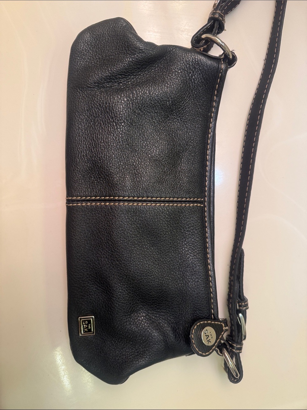 The Sak Black Pebbled Leather Wristlet Clutch with Contrast Stitching